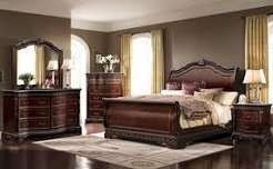Premium traditional mahogany sleigh bed set with matching 6-drawer dresser, arched mirror, and nightstands in a classic luxury bedroom setting.